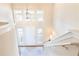 Bright foyer featuring soaring ceilings, hardwood floors, and ample natural light from the windows at 2577 Abbotts Glen Nw Dr, Acworth, GA 30101