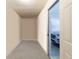 Hallway leading to garage featuring a glimpse of the front of a grey vehicle at 2577 Abbotts Glen Nw Dr, Acworth, GA 30101