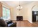 Inviting sitting room with dark wood floors, accent wall, and lots of natural light at 2577 Abbotts Glen Nw Dr, Acworth, GA 30101