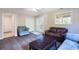 Finished living room with modern lighting, hardwood flooring, and comfortable seating at 2577 Abbotts Glen Nw Dr, Acworth, GA 30101