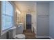 Bathroom features lots of natural light, tub/shower combo, and modern vanity at 3107 Hendrix Circle Sw, Covington, GA 30014
