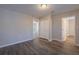 Bedroom shows walk-in closet, hardwood floors, and lots of natural light at 3107 Hendrix Circle Sw, Covington, GA 30014