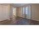 Bedroom with hardwood floors, access to a bathroom, and bright window at 3107 Hendrix Circle Sw, Covington, GA 30014