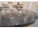 Close-up of the kitchen countertop with a swirling stardust design and lots of sheen at 3107 Hendrix Circle Sw, Covington, GA 30014