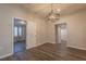 Dining room features modern light fixture and hardwood floors at 3107 Hendrix Circle Sw, Covington, GA 30014