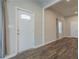 Bright entryway showcasing stylish flooring and access to other areas of the home at 3107 Hendrix Circle Sw, Covington, GA 30014