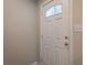 Close-up of the front door with a decorative window and modern hardware at 3107 Hendrix Circle Sw, Covington, GA 30014