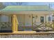 Charming home featuring a covered front porch, wooden railings and a metal roof at 3107 Hendrix Circle Sw, Covington, GA 30014