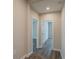 Hallway with wood-look flooring leads to bedrooms and other living spaces at 3107 Hendrix Circle Sw, Covington, GA 30014