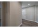 View of the home's hallway featuring a white front door and wood-look flooring at 3107 Hendrix Circle Sw, Covington, GA 30014