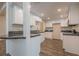 Bright kitchen features white cabinets, black counters, and wood-look floors at 3107 Hendrix Circle Sw, Covington, GA 30014