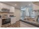 Well-lit kitchen features white cabinetry, dark countertop and stainless steel appliances at 3107 Hendrix Circle Sw, Covington, GA 30014