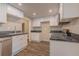 Modern kitchen features white cabinets, stainless steel appliances, and dark countertops at 3107 Hendrix Circle Sw, Covington, GA 30014