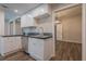 Bright kitchen with white cabinets, dark countertops, and stainless steel appliances at 3107 Hendrix Circle Sw, Covington, GA 30014