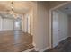 Open-concept living area with wood-look floors and a view of the dining area at 3107 Hendrix Circle Sw, Covington, GA 30014