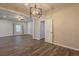 Living room shows modern light fixture, ceiling fan and hardwood floors at 3107 Hendrix Circle Sw, Covington, GA 30014