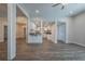 Open-concept living space leading to the kitchen with modern hardwood style flooring at 3107 Hendrix Circle Sw, Covington, GA 30014