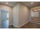 Open staircase leads to the main living area with an elegant chandelier at 3107 Hendrix Circle Sw, Covington, GA 30014