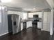 Contemporary kitchen with stainless steel appliances, granite counters, and shaker style cabinets at 4664 Ryan Rd, Conley, GA 30288