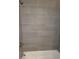 A stylish tiled shower is equipped with modern fixtures at 4664 Ryan Rd, Conley, GA 30288