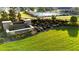 Beautifully landscaped community entrance with a stone water feature and view of the community pool at 473 Broder Farms Dr, Stockbridge, GA 30281
