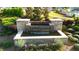Welcoming community entrance featuring a stone water feature and landscaped surroundings at 473 Broder Farms Dr, Stockbridge, GA 30281
