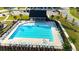 Aerial view of a large community pool with ample seating and a covered pavilion at 473 Broder Farms Dr, Stockbridge, GA 30281