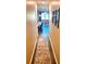 Hallway with luxury vinyl plank flooring, leading into the spacious living area at 473 Broder Farms Dr, Stockbridge, GA 30281