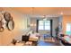 Living room features an elegant chandelier, neutral walls, and stylish decor at 473 Broder Farms Dr, Stockbridge, GA 30281