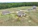 Overview of the property showcasing the house, detached garage, and expansive yard at 625 Henderson Mill Rd, Covington, GA 30014