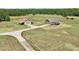 Wide aerial view of a home with a barn featuring ample land and private driveway at 625 Henderson Mill Rd, Covington, GA 30014
