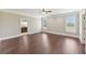 Spacious bedroom with hardwood floors, trim, ceiling fan, and natural light from the exterior windows at 625 Henderson Mill Rd, Covington, GA 30014