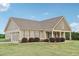 Beautifully landscaped home featuring an attached garage and inviting front porch at 625 Henderson Mill Rd, Covington, GA 30014
