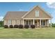 Charming single-story home with a welcoming front porch and well-manicured lawn at 625 Henderson Mill Rd, Covington, GA 30014