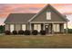 Charming single-story home with a welcoming front porch and well-manicured lawn at 625 Henderson Mill Rd, Covington, GA 30014