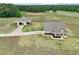 Expansive property featuring a house with a covered porch and detached garage at 625 Henderson Mill Rd, Covington, GA 30014