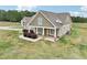 Charming home with a covered porch and manicured landscaping in a spacious yard at 625 Henderson Mill Rd, Covington, GA 30014