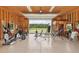 Spacious garage with roll up door and gym equipment overlooking large acreage at 625 Henderson Mill Rd, Covington, GA 30014