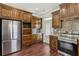 Beautiful kitchen with stainless steel appliances and ample wood cabinets and granite countertops at 625 Henderson Mill Rd, Covington, GA 30014