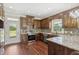Modern kitchen with stainless steel appliances, granite countertops, and ample wood cabinets at 625 Henderson Mill Rd, Covington, GA 30014