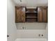 Charming laundry area with wood cabinetry and convenient utility connections above the appliances at 625 Henderson Mill Rd, Covington, GA 30014