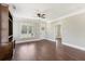 Bright living room boasting wood floors, built-in shelving, and access to the outdoors at 625 Henderson Mill Rd, Covington, GA 30014