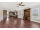 Open-concept living space featuring hardwood floors and seamless flow to the modern kitchen at 625 Henderson Mill Rd, Covington, GA 30014