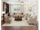 Staged living room with neutral furniture, wood floors and large window at 625 Henderson Mill Rd, Covington, GA 30014