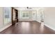 Spacious living room featuring wood floors, built-in shelving, and a bright window view at 625 Henderson Mill Rd, Covington, GA 30014