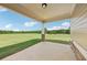 Covered porch featuring stone column base and an expansive green view at 625 Henderson Mill Rd, Covington, GA 30014