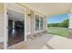Inviting covered porch with stone accents offering a glimpse into the home's interior at 625 Henderson Mill Rd, Covington, GA 30014