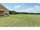 Exterior showing well-manicured acreage of yard with house on left at 625 Henderson Mill Rd, Covington, GA 30014