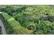 Secluded home nestled beside a golf course and surrounded by lush, mature trees at 945 Tiber Cir, Alpharetta, GA 30022
