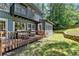 Rear exterior view featuring spacious outdoor deck and backyard at 945 Tiber Cir, Alpharetta, GA 30022